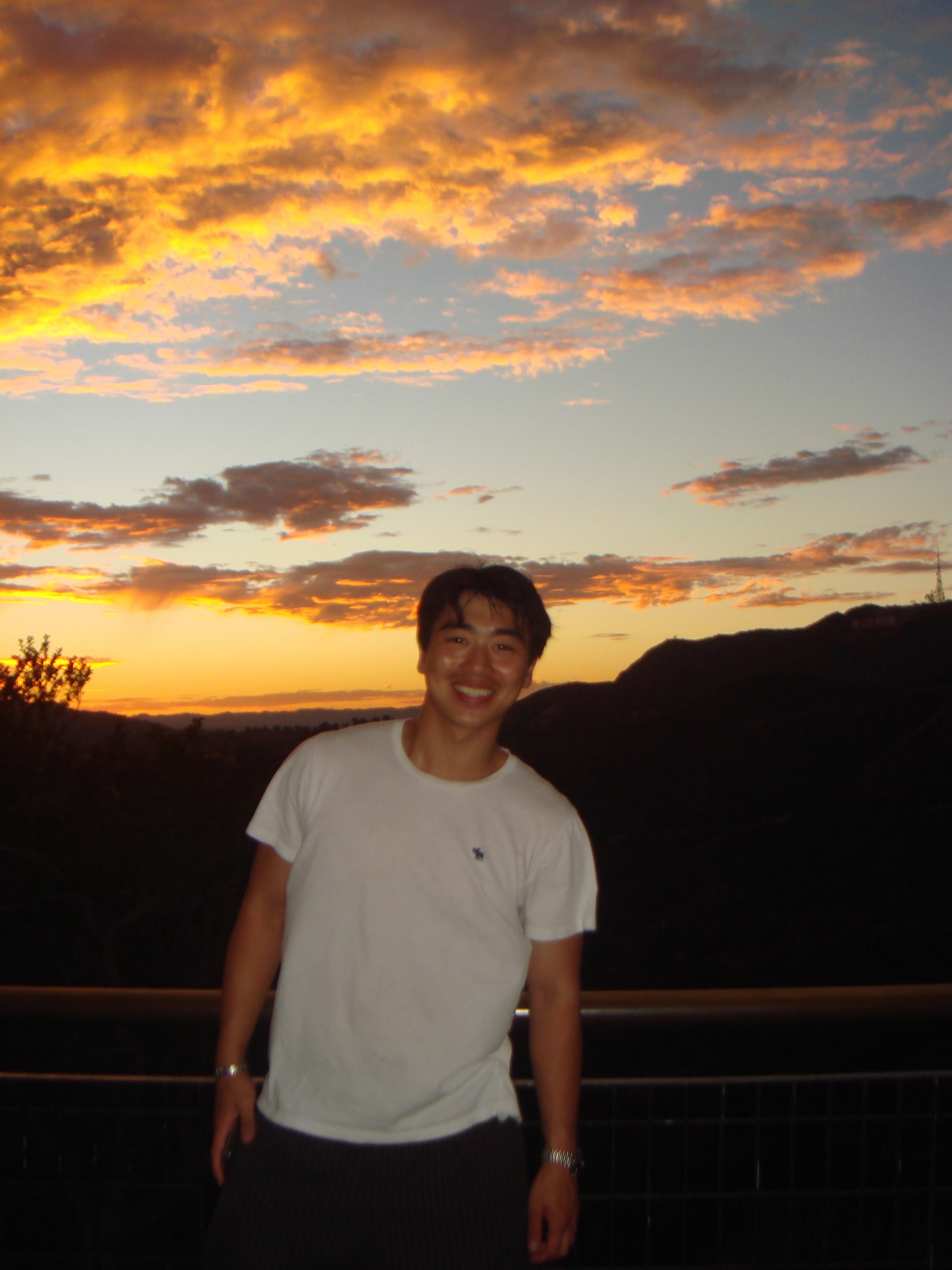 Anderson smiling outdoors at sunset